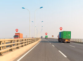 container-trucks-on-cross-sea-bridge-P9KMM7M