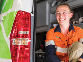 Team member sitting in the back of a work van